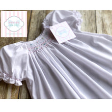Smocked gown by Petit Ami NB